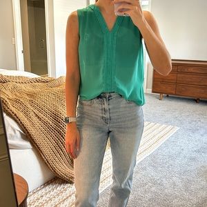 Francesca’s green v-neck blouse